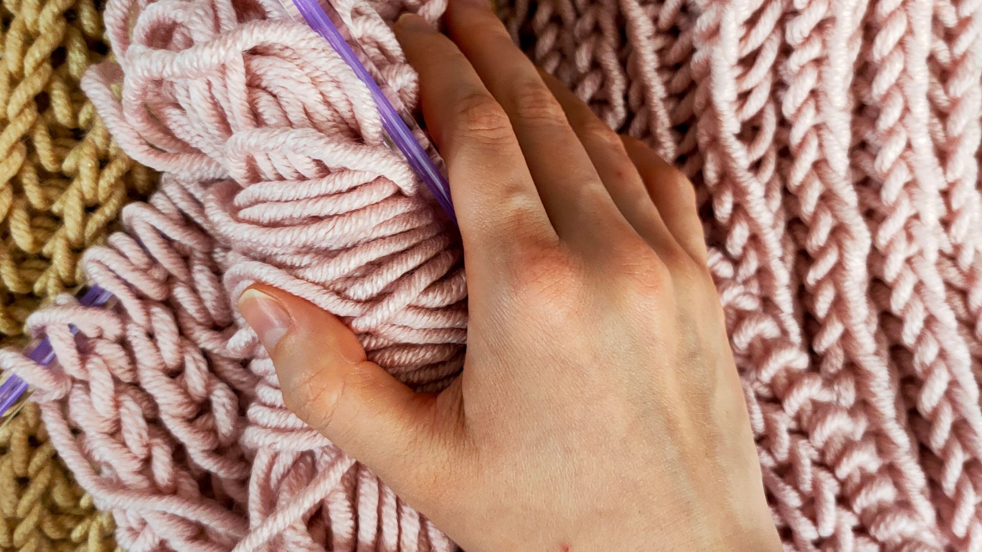 A Person Holding a Pink Yarn