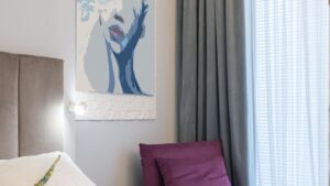 Bedroom interior with painting on wall in hotel