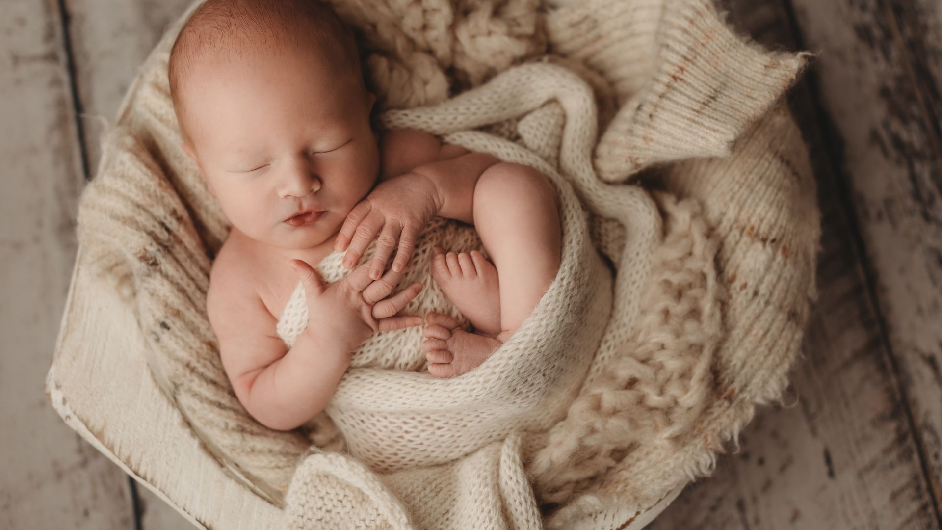 Cute Baby Wrapped with Knitted Blanket