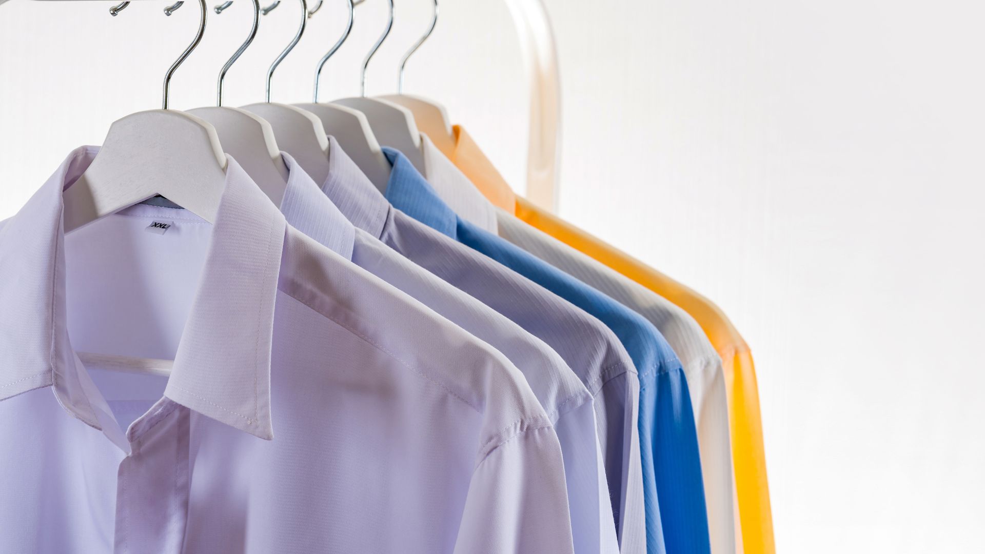 Hangers with formal shirts on rack