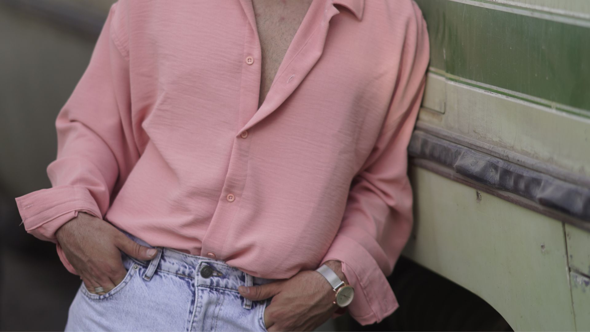 Man in Pink Dress Shirt and Blue Denim Jeans Wearing Black Sunglasses