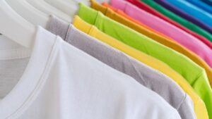 Minimalist multicolored t shirts on hangers