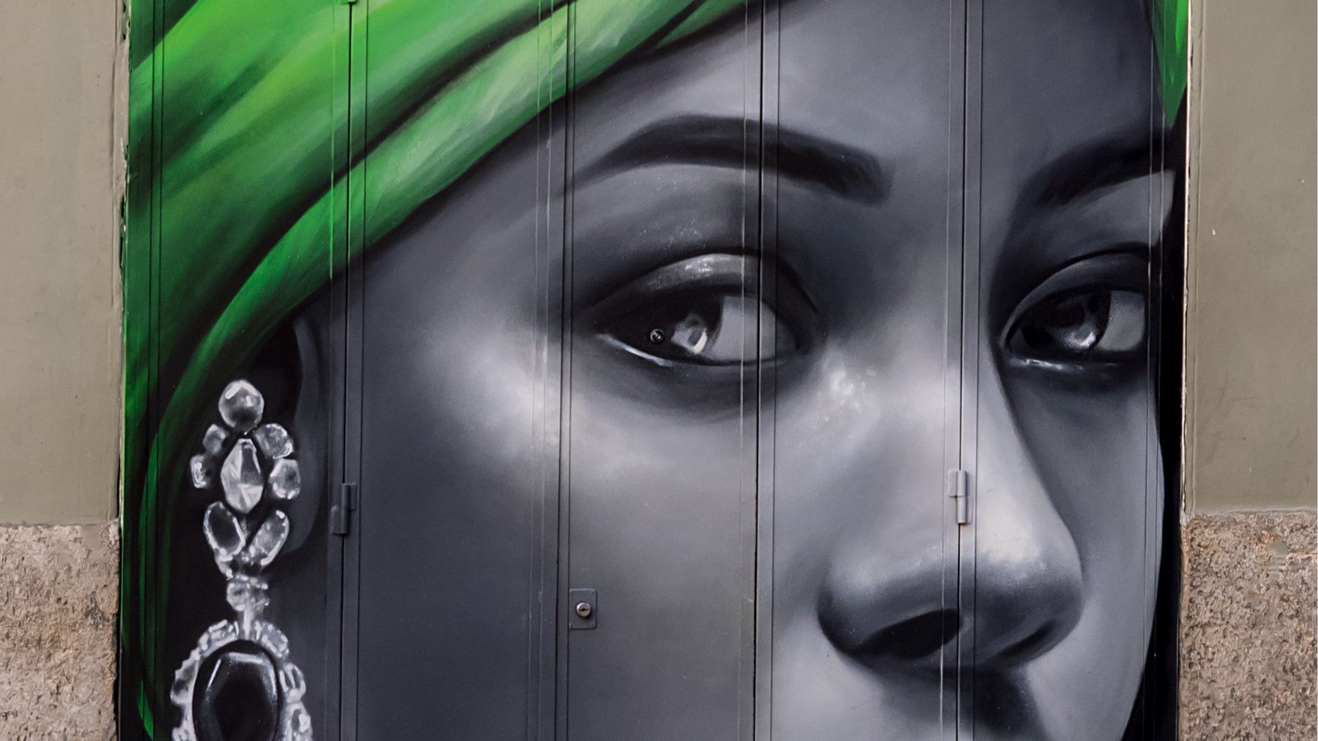 Mural Painting of Woman's Face on Door