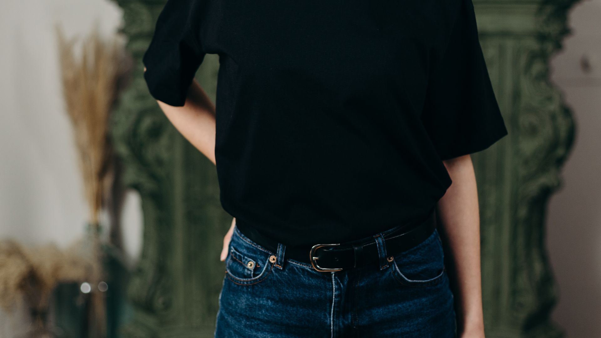 Person Wearing Black T-Shirt and Denim Jeans