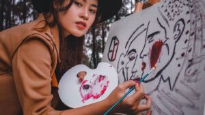 Photo Of Woman Holding Paint Brush