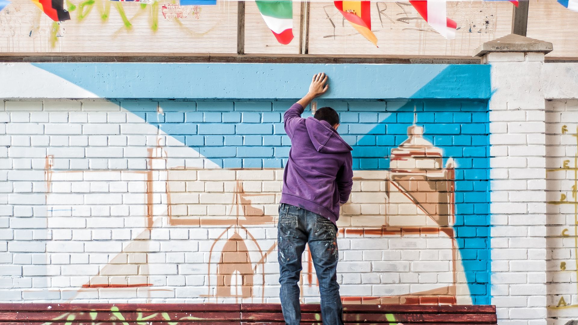 Street Artist Painting a Mural M,