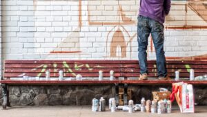 Street Artist Painting a Mural kl