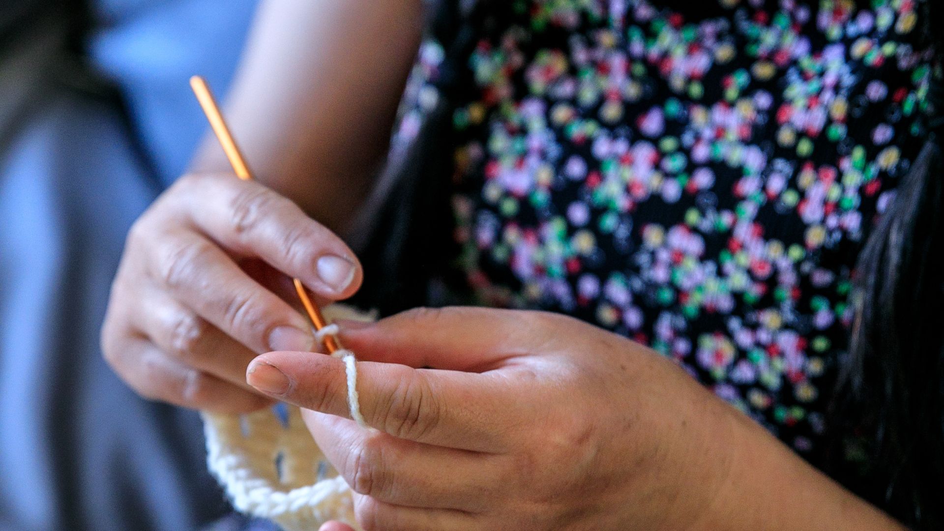 Woman Using a Gray Yarn in her Crochet